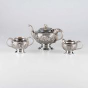 AN EARLY 20TH CENTURY ANGLO-INDIAN SILVER THREE-PIECE TEA SERVICE
