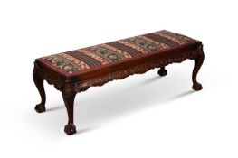 A CHIPPENDALE STYLE MAHOGANY AND UPHOLSTERED LONG STOOL, LATE 19TH CENTURY