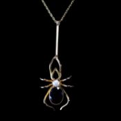 AN EDWARDIAN YELLOW GOLD GARNET AND PEARL INSECT PENDANT NECKLACE