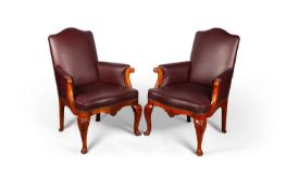 A PAIR OF LATE 19TH CENTURY STAINED AND CARVED BEECH UPHOLSTERED LIBRARY CHAIRS
