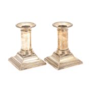 A PAIR OF GEORGE V SILVER CANDLESTICKS