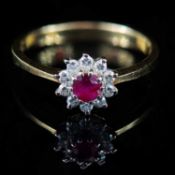 AN 18 CARAT YELLOW GOLD RUBY AND DIAMOND CLUSTER RING