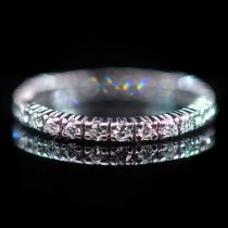 A PLATINUM AND DIAMOND ETERNITY RING