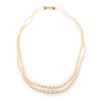 A NATURAL SALTWATER DOUBLE STRAND GRADUATED PEARL NECKLACE