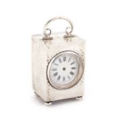 AN EDWARDIAN SILVER CASED CARRIAGE CLOCK