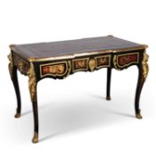 A LOUIS XV STYLE GILT-METAL MOUNTED EBONISED WRITING TABLE