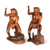 A PAIR OF SOUTH-EAST ASIAN CARVED WOOD FIGURES OF HUNTERS, 20TH CENTURY