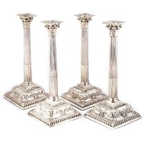 A SET OF FOUR EARLY GEORGE III SILVER CANDLESTICKS