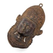 A TIBETAN BRONZE BUDDHIST DEITY WALL MASK