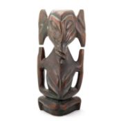 AN AFRICAN TRIBAL CARVED WOOD STYLISED ELEPHANT