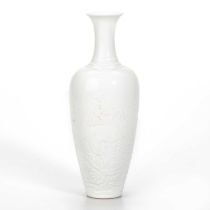 A CHINESE WHITE-GLAZED PORCELAIN VASE