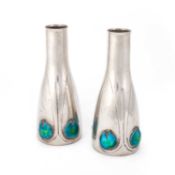 ARCHIBALD KNOX (1864-1933) FOR LIBERTY & CO, A PAIR OF TUDRIC PEWTER AND ENAMEL VASES