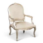 AN ANDREW MARTIN SILVERED AND UPHOLSTERED FAUTEUIL