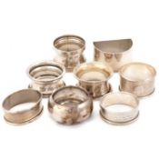 EIGHT SILVER NAPKIN RINGS