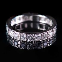 A DIAMOND HALF ETERNITY RING