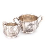 A CHINESE SILVER CREAM JUG AND TWO-HANDLED SUGAR BOWL