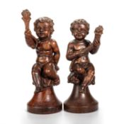 A PAIR OF CARVED WOOD PUTTI