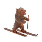 A BLACK FOREST NOVELTY CARVING OF A SKIING BEAR, CIRCA 1900