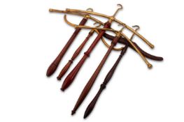 A GROUP OF BRASS-MOUNTED BARRISTER'S WIG AND GOWN ROTATING HANGERS/ HOLDERS