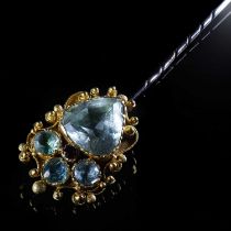 A 19TH CENTURY STYLE AQUAMARINE AND GARNET STICK PIN