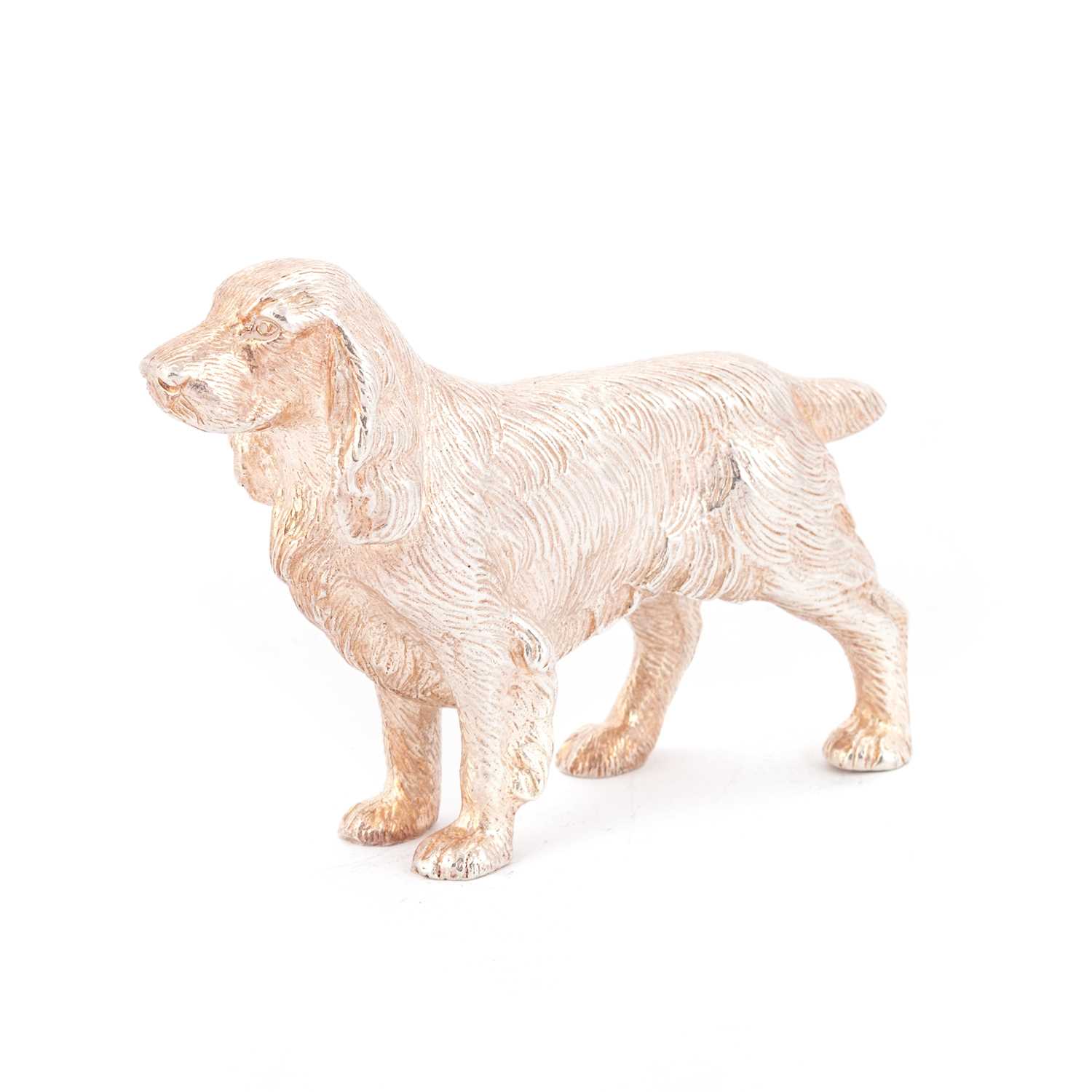 AN ELIZABETH II SILVER MODEL OF A DOG