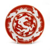 A CHINESE IRON-RED 'DRAGON' DISH