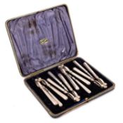 A SET OF EDWARDIAN SILVER LOBSTER CRACKERS AND PICKS