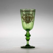 A LATE 19TH CENTURY ARMORIAL GREEN GLASS GOBLET