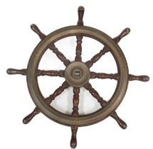 A BRASS-MOUNTED TEAK SHIPS WHEEL