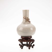 A CHINESE MONOCHROME-GLAZED 'DRAGON' BOTTLE VASE