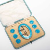 A CASED EDWARDIAN SILVER-GILT AND TURQUOISE ENAMEL BUCKLE AND BUTTON SET