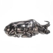 A CHINESE GREY-BLACK CERAMIC MODEL OF A RECUMBENT WATER BUFFALO OR OTHER BOVINE, 19TH CENTURY
