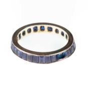 A SYNTHETIC SAPPHIRE ETERNITY RING