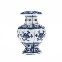 A CHINESE BLUE AND WHITE POMEGRANATE-SHAPED BUDDHIST TREASURE VASE