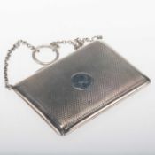 A GEORGE V ENGINE-TURNED SILVER CARD CASE