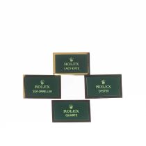 FOUR ROLEX DISPLAY PLAQUES