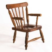 A VICTORIAN BEECH CHILD'S COMMODE CHAIR