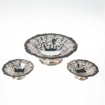 A FINE SET OF THREE GEORGE V SILVER TABLE BASKETS