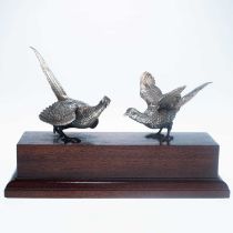 A PAIR OF ELIZABETH II SILVER MODELS OF PHEASANTS