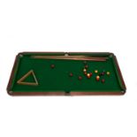A QUARTER-SIZE TABLE-TOP SNOOKER TABLE