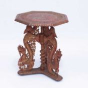 AN INDO-CHINESE CARVED AND PAINTED OCCASIONAL TABLE