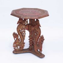 AN INDO-CHINESE CARVED AND PAINTED OCCASIONAL TABLE