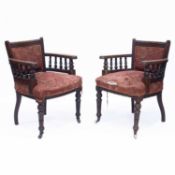 A PAIR OF VICTORIAN WALNUT LIBRARY CHAIRS, IN THE MANNER OF LAMB OF MANCHESTER
