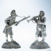 A PAIR OF GERMAN CAST SILVER FIGURES