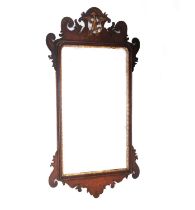 A GEORGE III MAHOGANY FRETWORK MIRROR