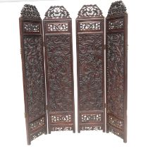 AN EARLY 20TH CENTURY CHINESE HARDWOOD FOUR-PANEL DRESSING SCREEN