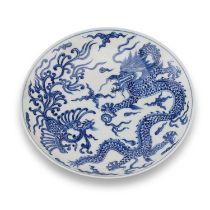A CHINESE BLUE AND WHITE 'DRAGON AND PHOENIX' DISH