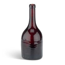 A BROWN GLASS BOTTLE, CIRCA 1820