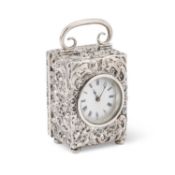 A SMALL EDWARDIAN SILVER TRAVELLING CLOCK