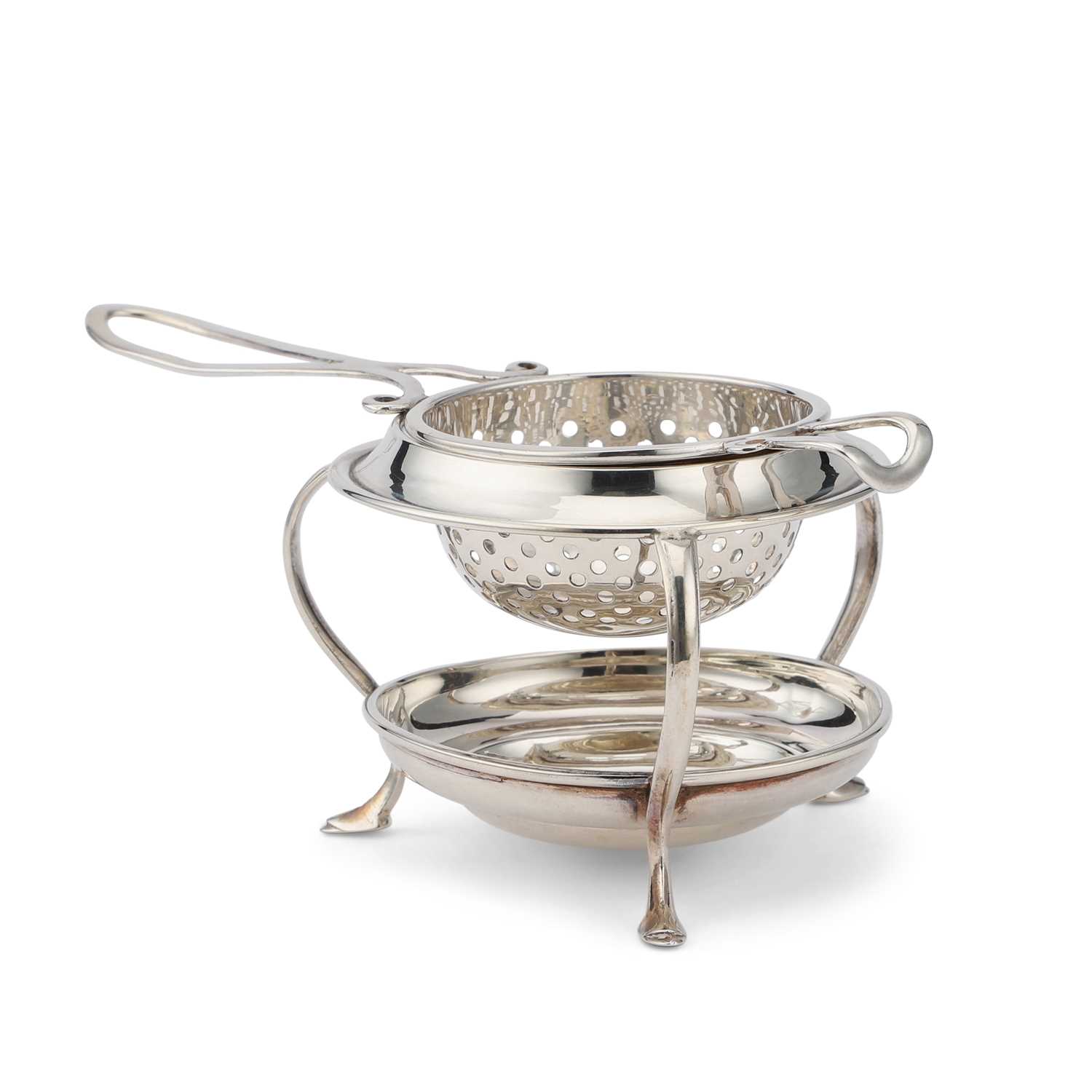 A GEORGE V SILVER TEA STRAINER